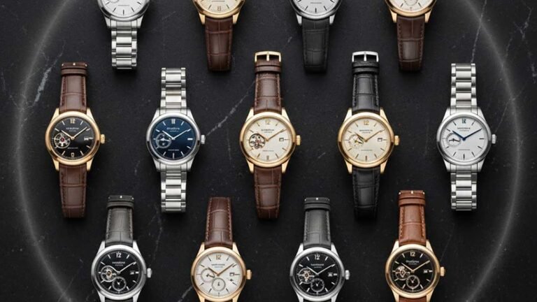 Luxury flat lay of rare expensive watches on dark stone with high-contrast lighting.